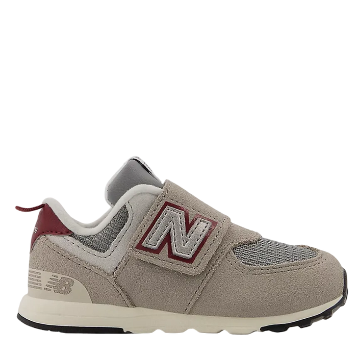 Gray sneaker with red accents on a white background