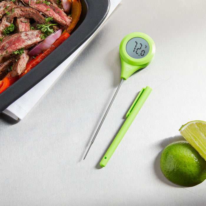 TruTemp rotating display waterproof thermometer beside a stainless steel tray of roasted meat and vegetables.
