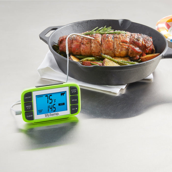 TruTemp wired programmable thermometer with probe inserted into a roast resting in a cast iron skillet with rosemary