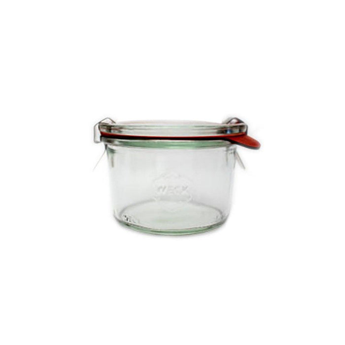 Clear glass 751 Weck Mold Jar with lid and clamps on white background
