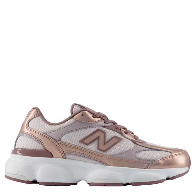Rose gold sneaker with white sole on a white background