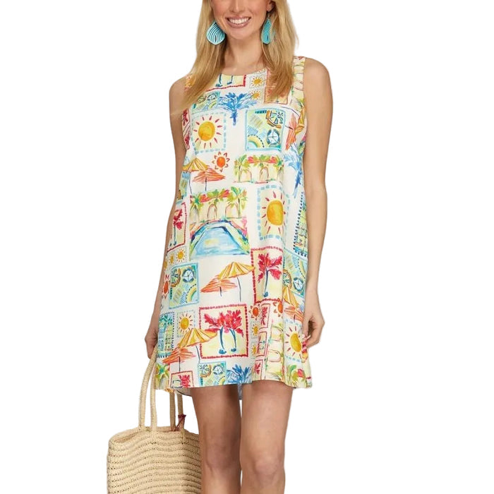 Woman wearing a colorful sleeveless dress with a pattern of animals and nature, holding a woven bag.