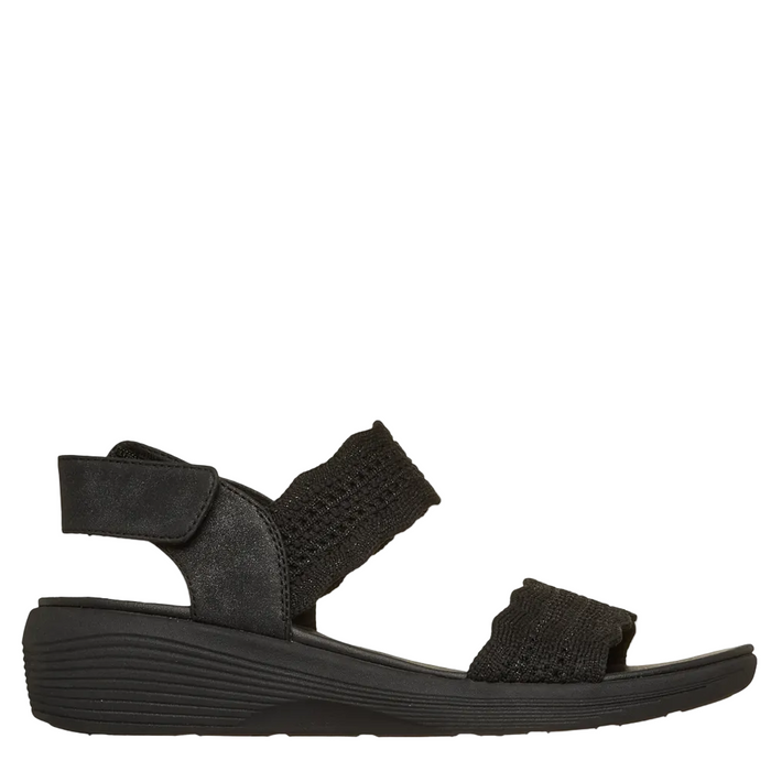 Black sandal with a strap on a white background