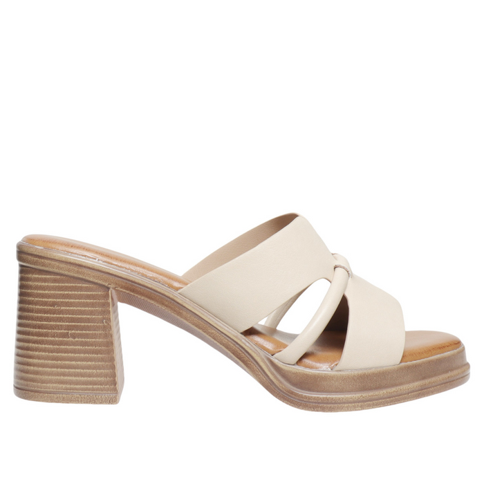 White sandal with a block heel on a white background