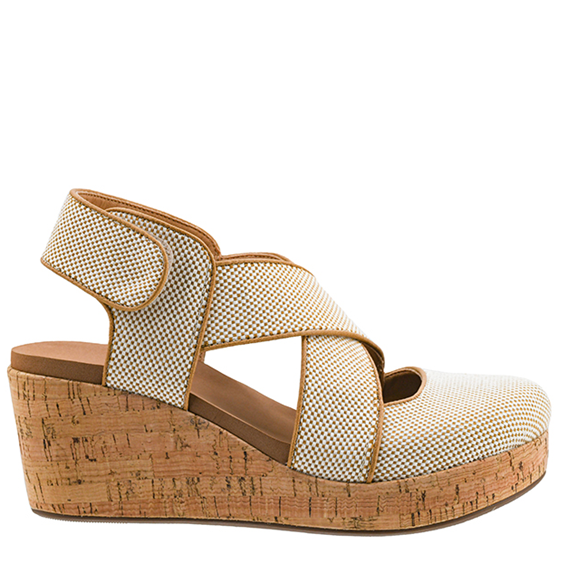Wedge sandal with mesh upper and cork wedge on a white background