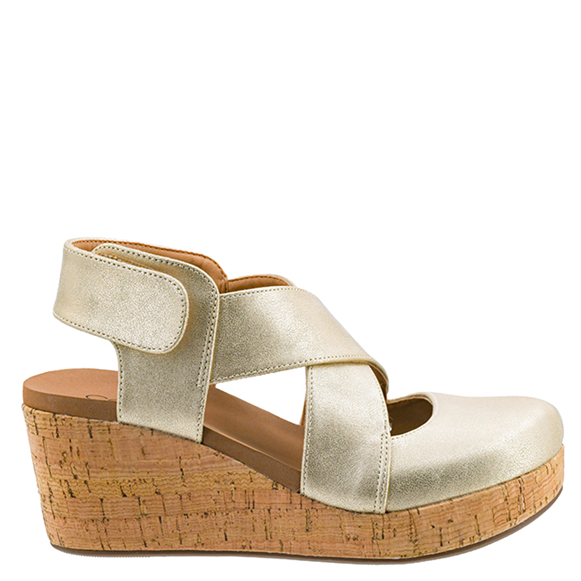 Gold wedge sandal with cork sole on a white background