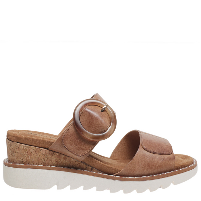 Brown sandal with a platform sole on a white background