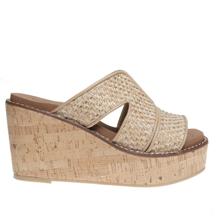 Beige wedge sandal with cork sole on a white background
