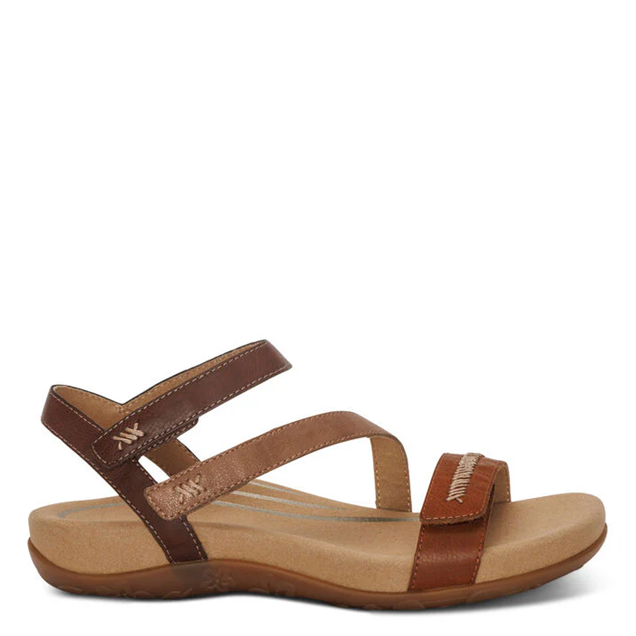 Brown sandal with wooden sole on a white background