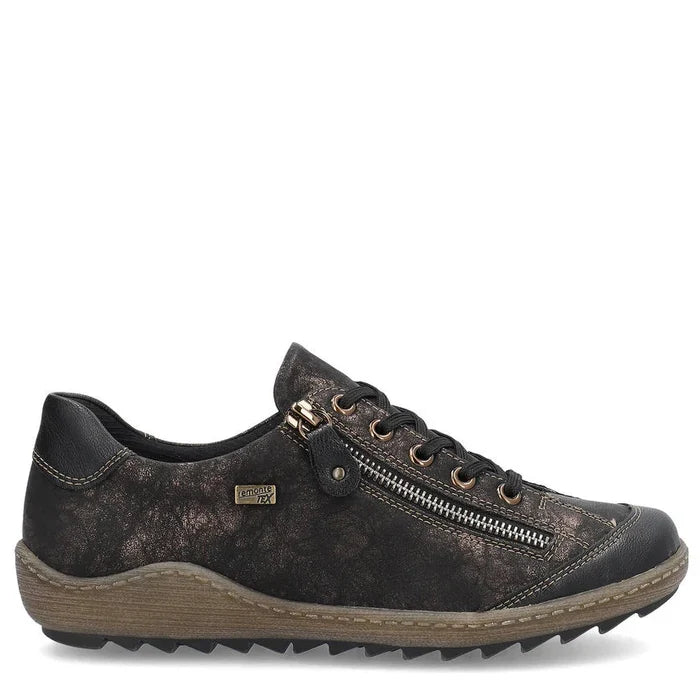 Black leather sneaker with a gold zipper on a white background